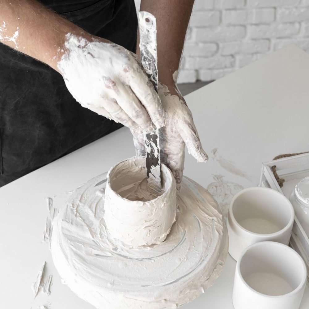high-angle-man-working-with-clay