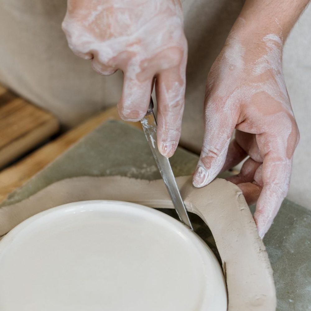 woman-making-clay-pot-her-workshop